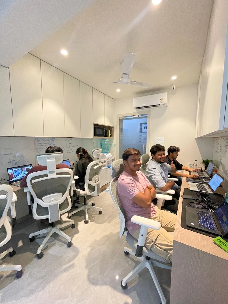 Beacon Minds team at their desks in the Mumbai office